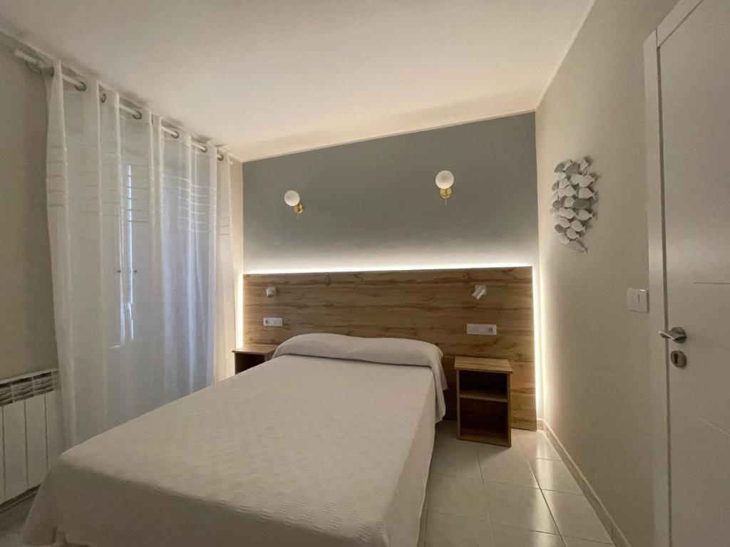 Postel nebo postele na pokoji v ubytování Grupo Las Catedrales - Hotel Amadora