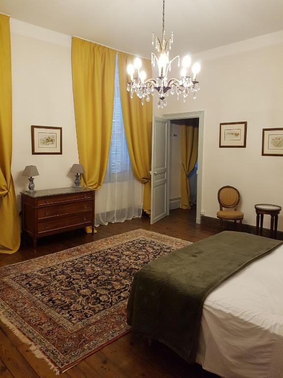 Postel nebo postele na pokoji v ubytování Château St Justin
