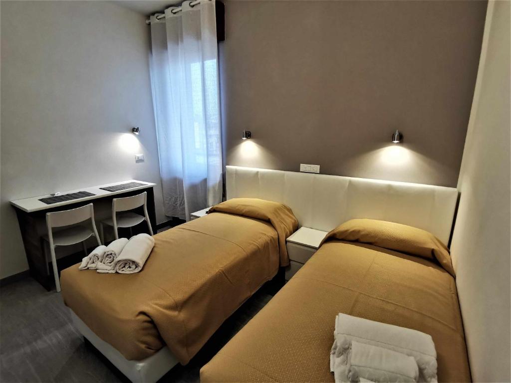 Łóżko lub łóżka w pokoju w obiekcie Casa Belfiore Vicenza Medici 17