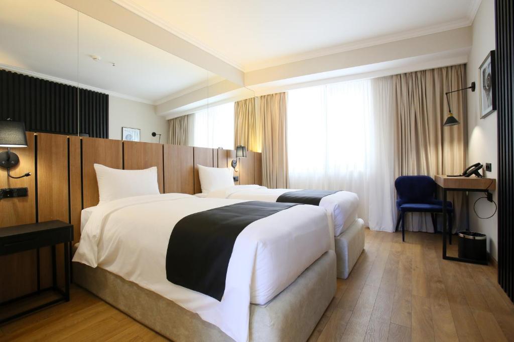 Postel nebo postele na pokoji v ubytování Genesis Kosher Hotel Tbilisi
