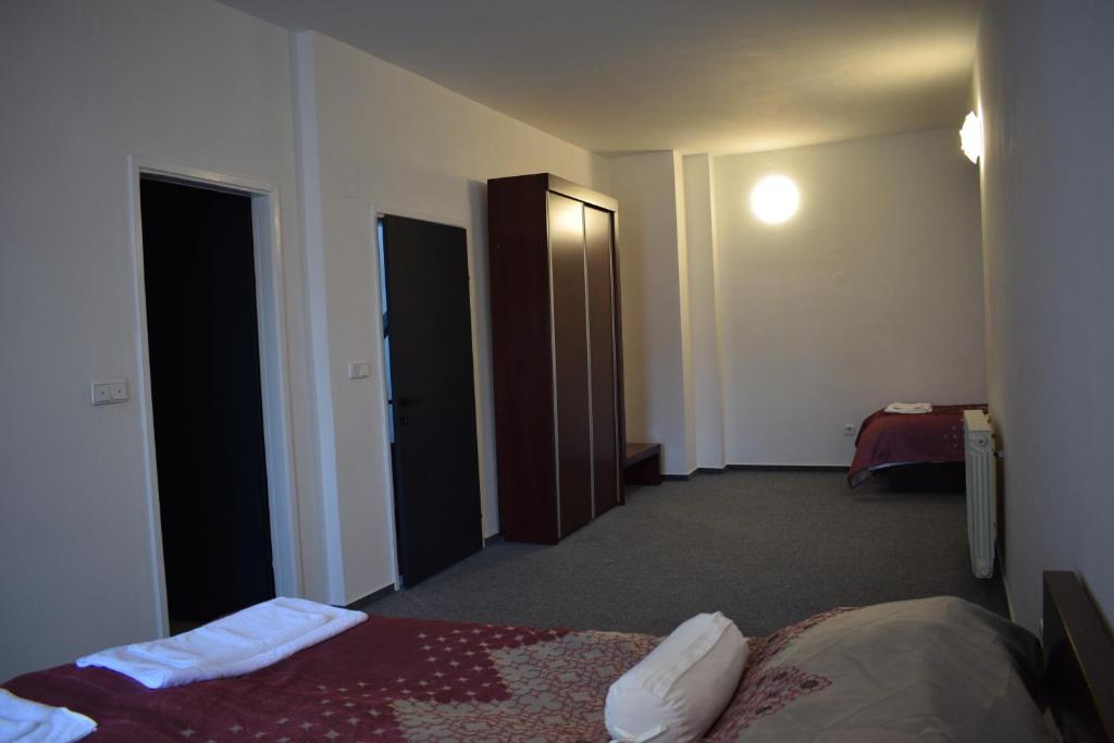 Postel nebo postele na pokoji v ubytování Hotel Begić