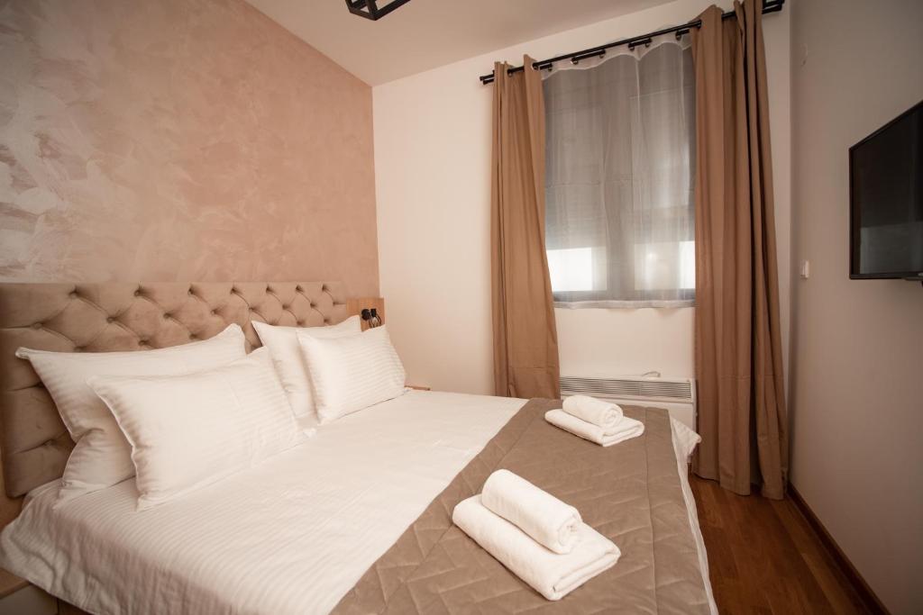Postel nebo postele na pokoji v ubytování All Seasons Residence