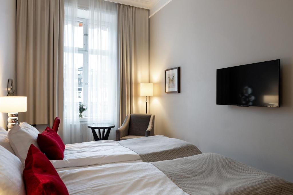 Postel nebo postele na pokoji v ubytování Elite Stora Hotellet Linköping