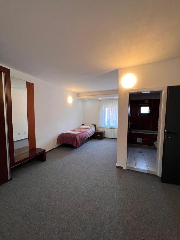 Postel nebo postele na pokoji v ubytování Hotel Begić