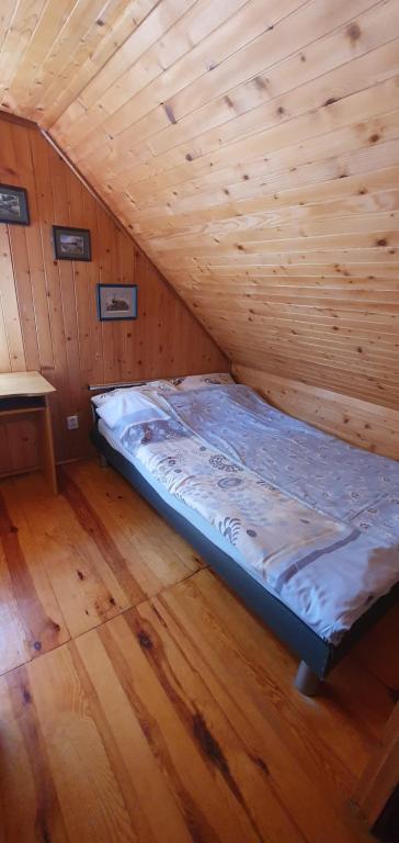 Postel nebo postele na pokoji v ubytování Domek u Kacperka