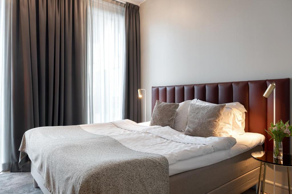 Postel nebo postele na pokoji v ubytování Elite Hotel Academia
