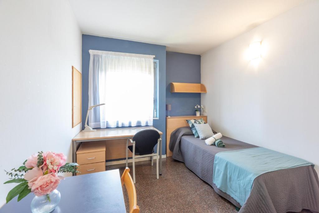 Posteľ alebo postele v izbe v ubytovaní Residencia Universitaria Resa La Ciutadella