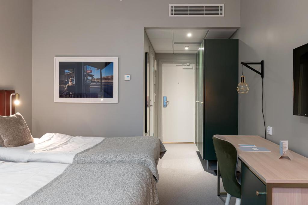 Postel nebo postele na pokoji v ubytování Elite Hotel Academia