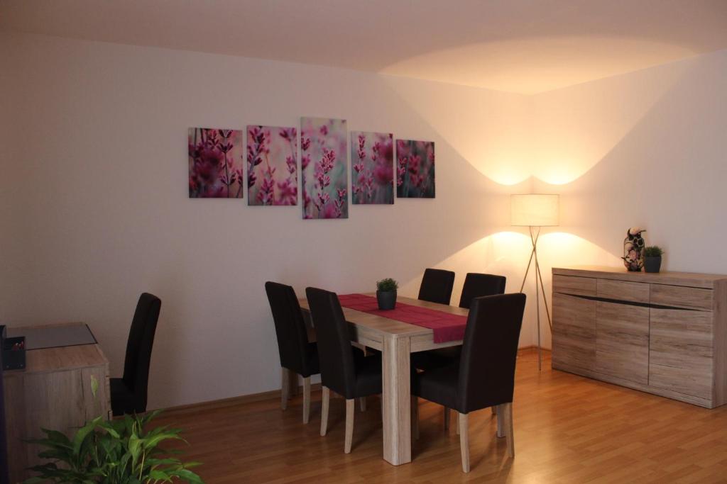 a dining room with a table and chairs at City-Appartement 3.2. in Zwickau