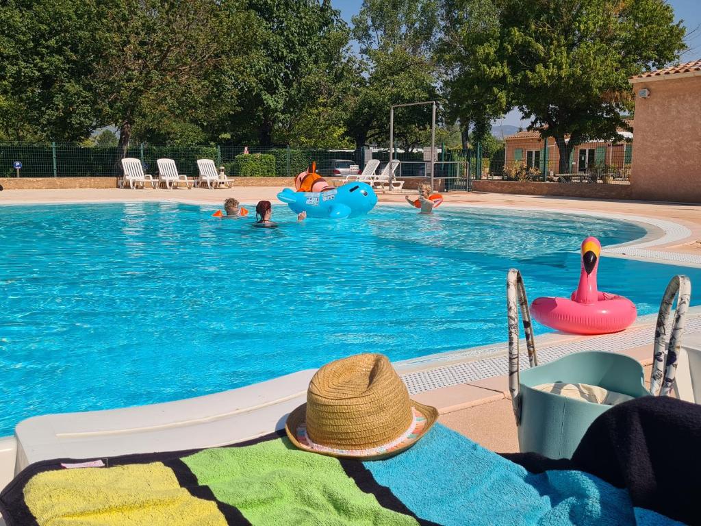 a pool with people playing in the water at Camping Tikayan L'Oxygène in Valensole