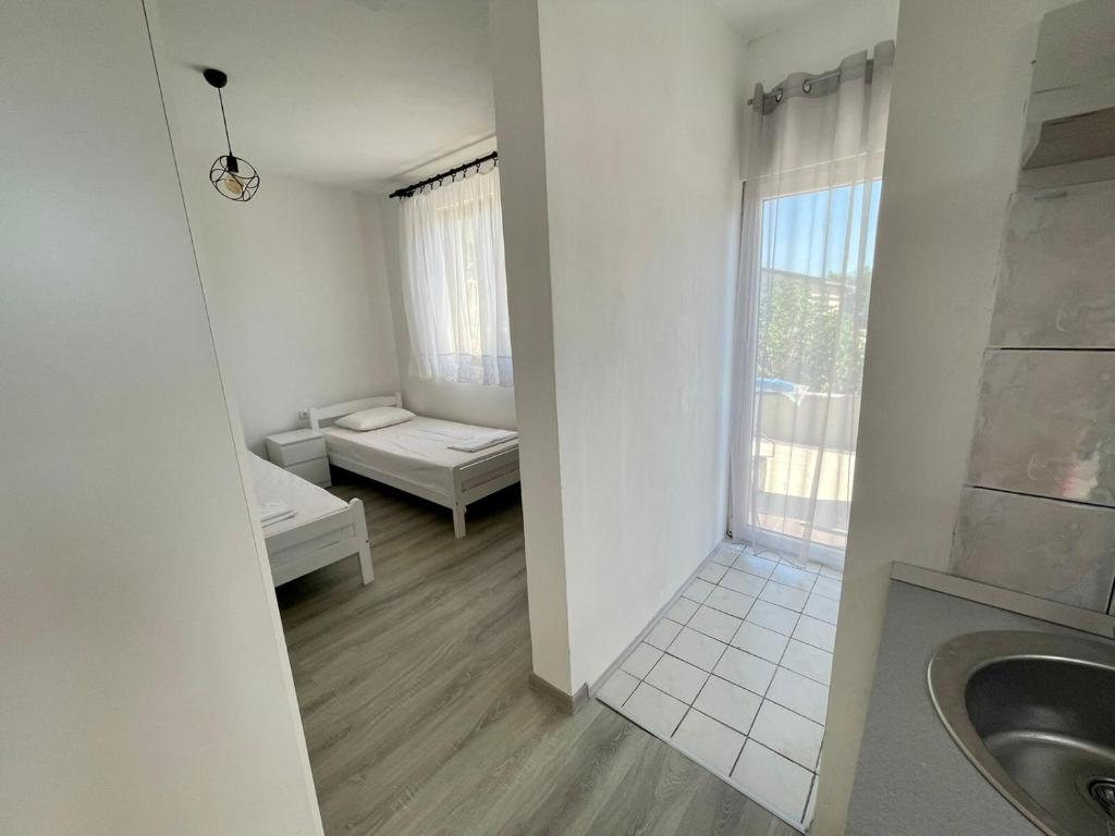 Postel nebo postele na pokoji v ubytování White apartments