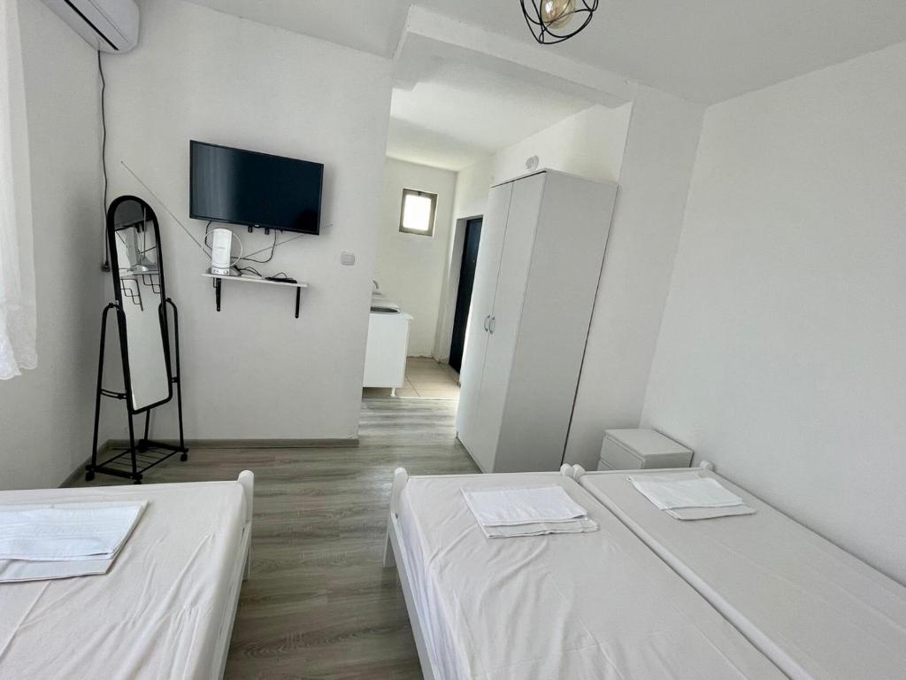 Кровать или кровати в номере White apartments