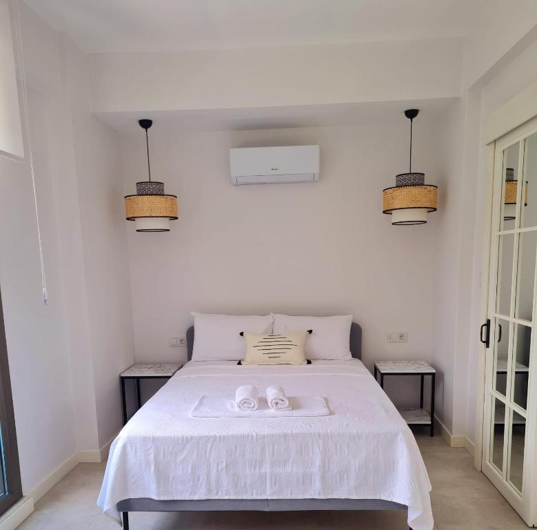 A bed or beds in a room at Ozilvillas