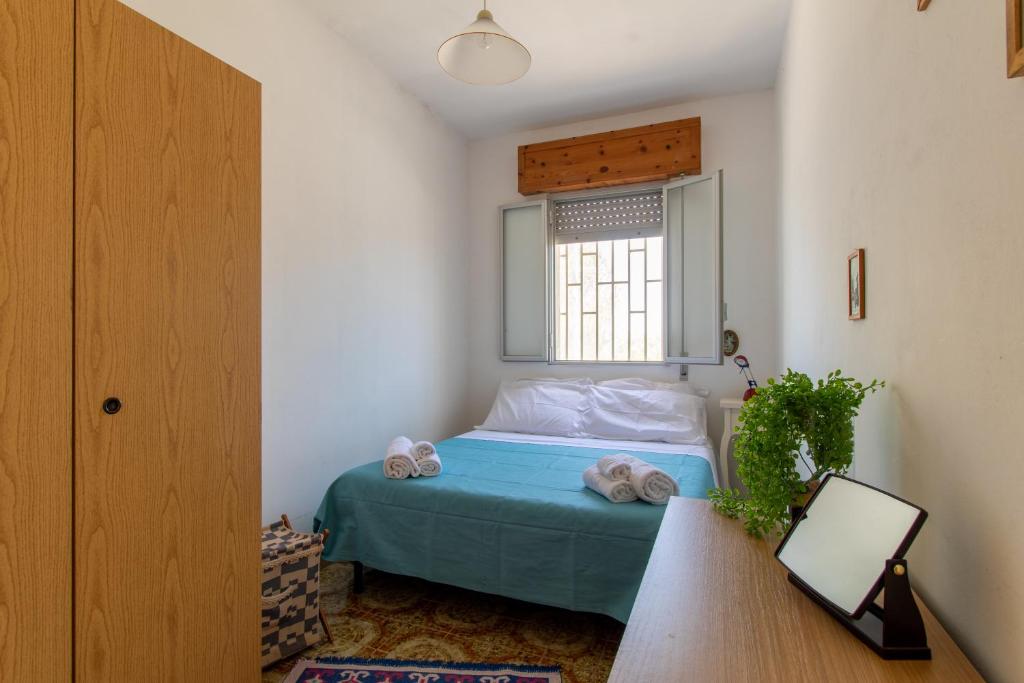 Łóżko lub łóżka w pokoju w obiekcie La casa di Ulisse 2