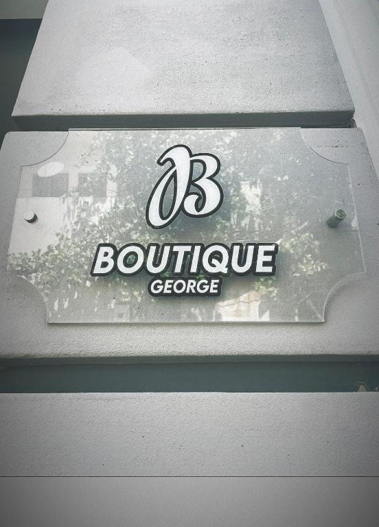 Certifikát, hodnocení, plakát nebo jiný dokument vystavený v ubytování Hotel Boutique George