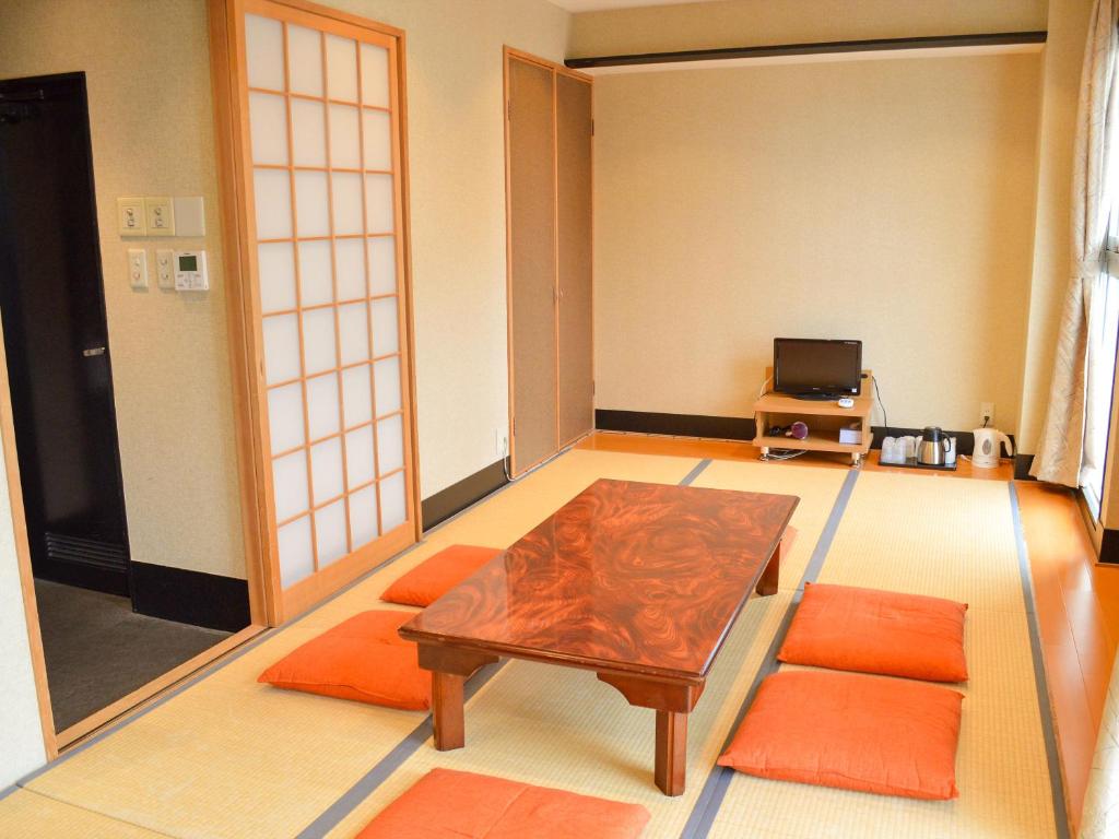 TV a/nebo společenská místnost v ubytování Amenity Hotel Kyoto