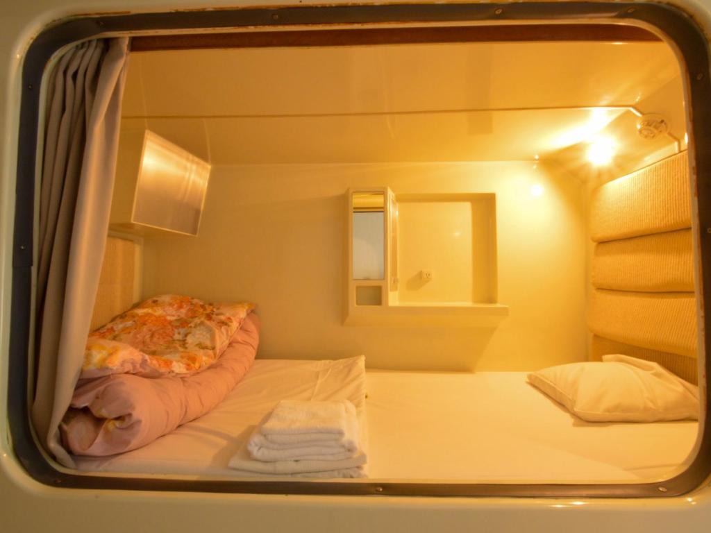 Postel nebo postele na pokoji v ubytování Amenity Hotel Kyoto