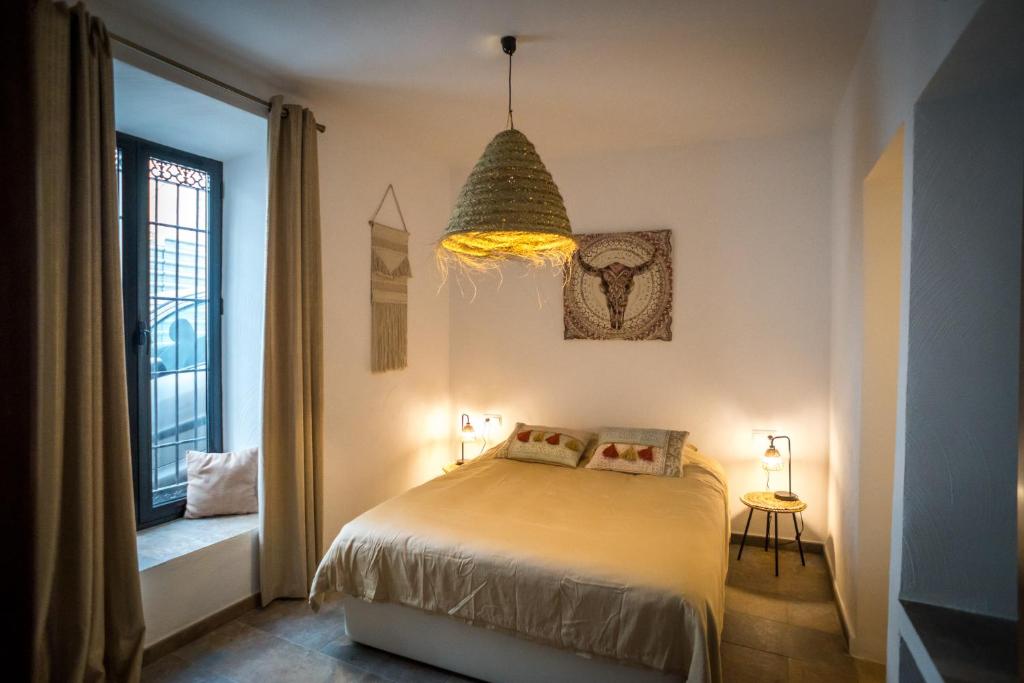 Łóżko lub łóżka w pokoju w obiekcie Suites del Mundo