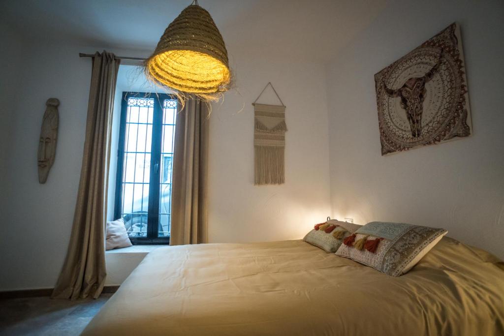 Łóżko lub łóżka w pokoju w obiekcie Suites del Mundo