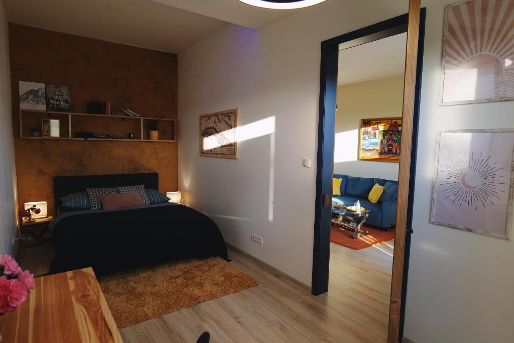 A bed or beds in a room at Apartmán - modern home