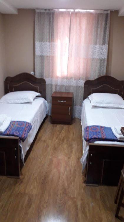 Postel nebo postele na pokoji v ubytování Gues House Aisi