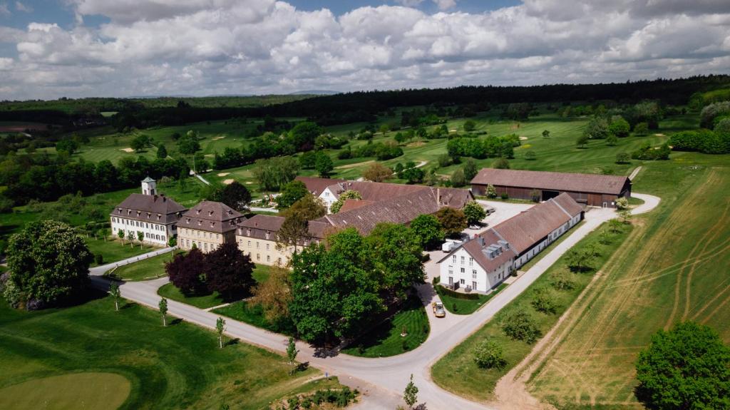 an aerial view of a large building with a road at Appartements am Rindhof in Münnerstadt