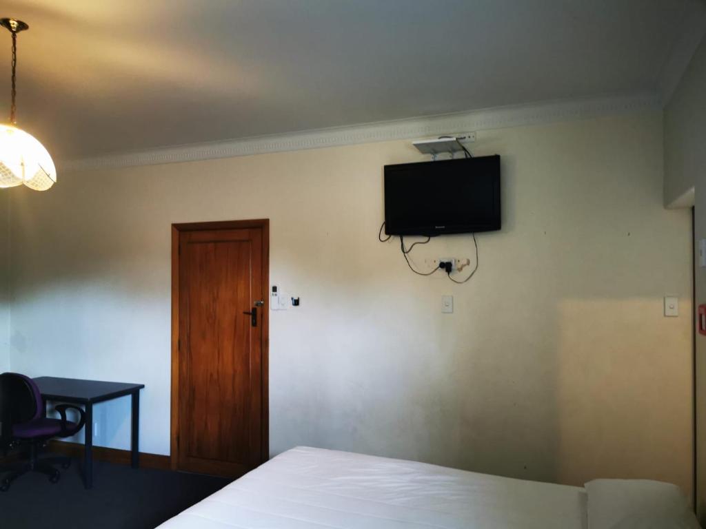 TV a/nebo společenská místnost v ubytování Harrison Motel Papatoetoe