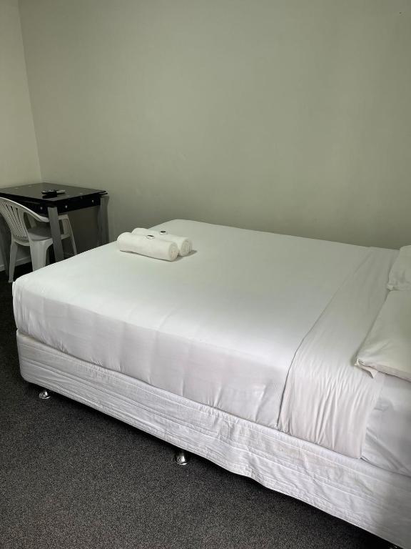 Postel nebo postele na pokoji v ubytování Dash Motel, Papakura