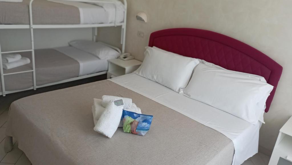 Postel nebo postele na pokoji v ubytování Hotel Raul
