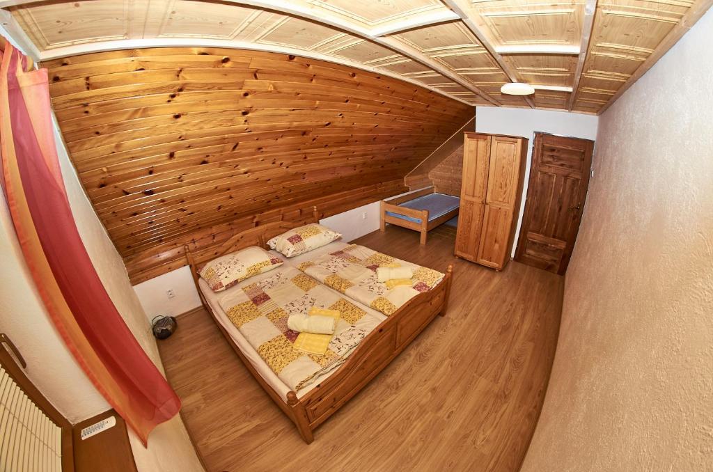 Postel nebo postele na pokoji v ubytování Apartmany pod Tatrami