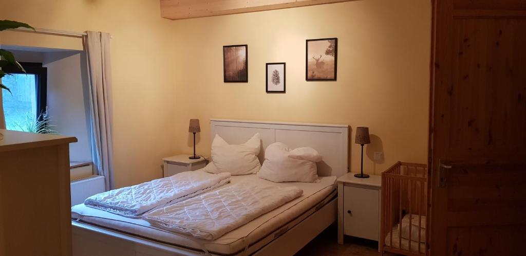Postel nebo postele na pokoji v ubytování Neumühle