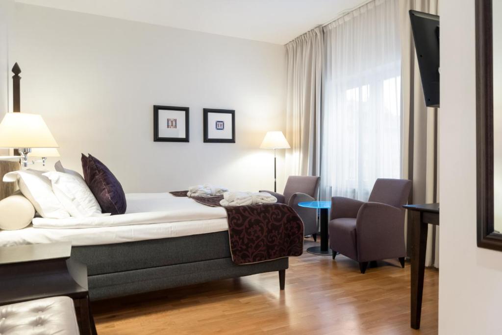 Postel nebo postele na pokoji v ubytování Elite Hotel Arcadia