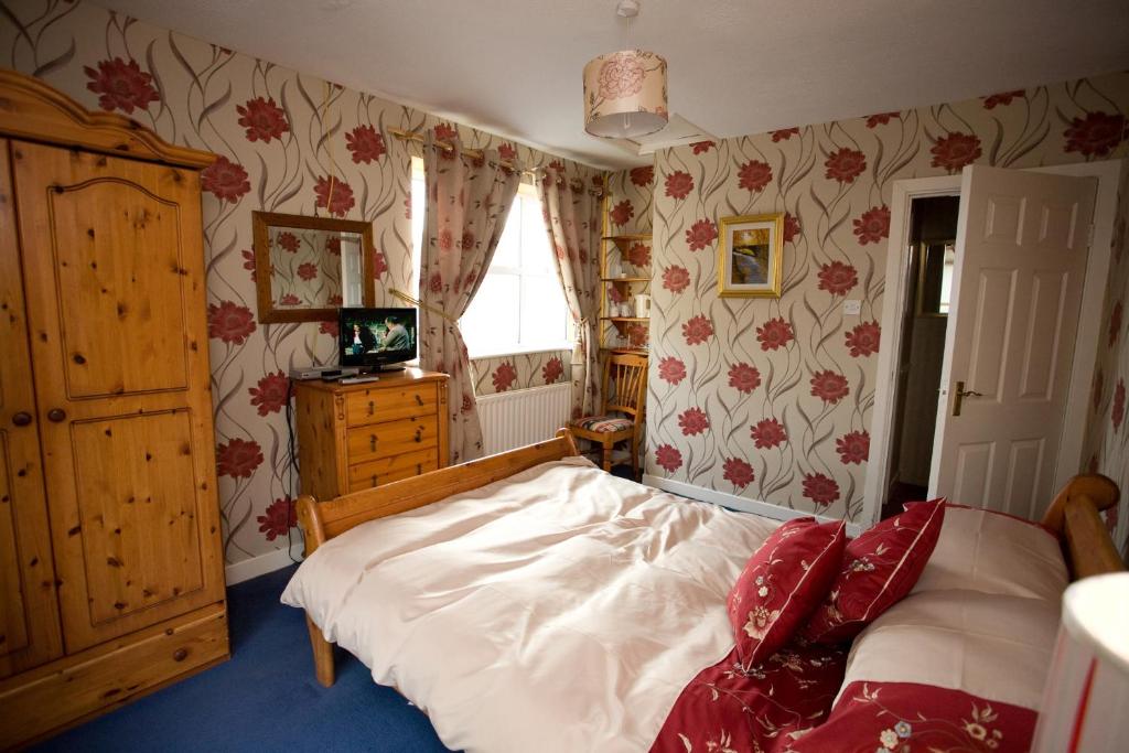 Postel nebo postele na pokoji v ubytování Evergreen Bed & Breakfast