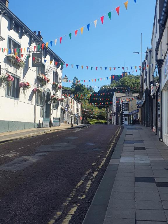 an empty city street with a string of flags at Clitheroe holiday let in Clitheroe