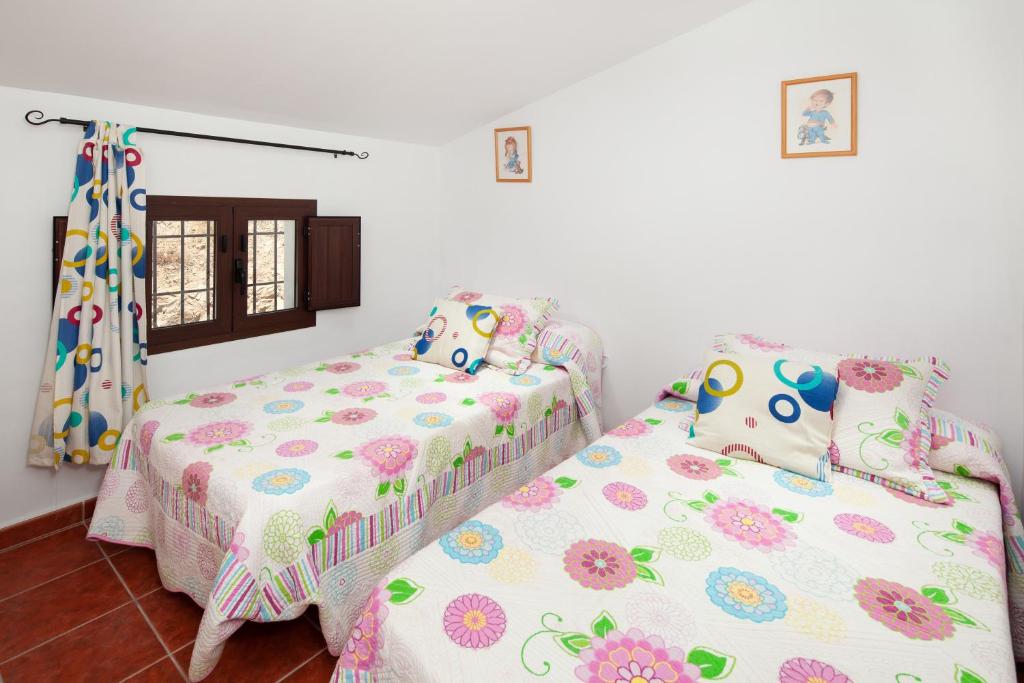 A bed or beds in a room at Casita T