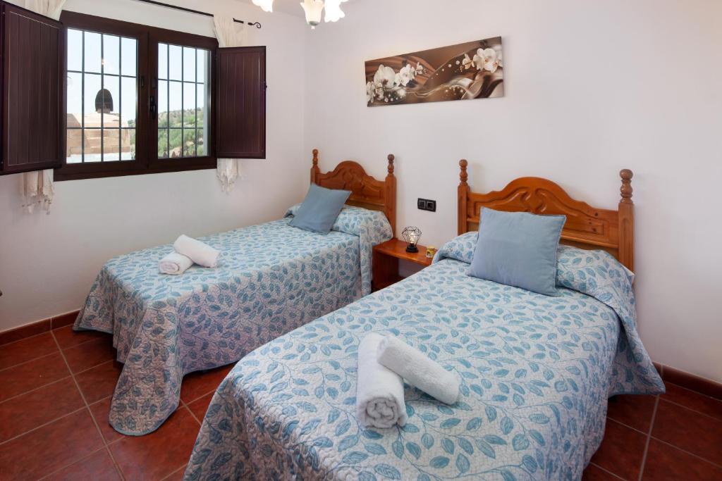 A bed or beds in a room at Casita T