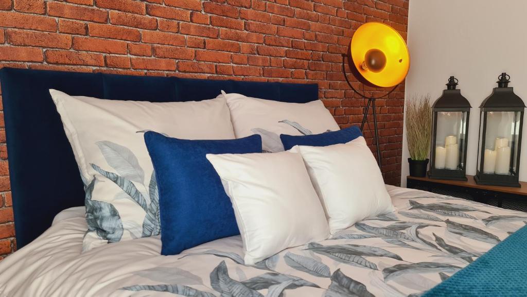 מיטה או מיטות בחדר ב-Apartament Indygo