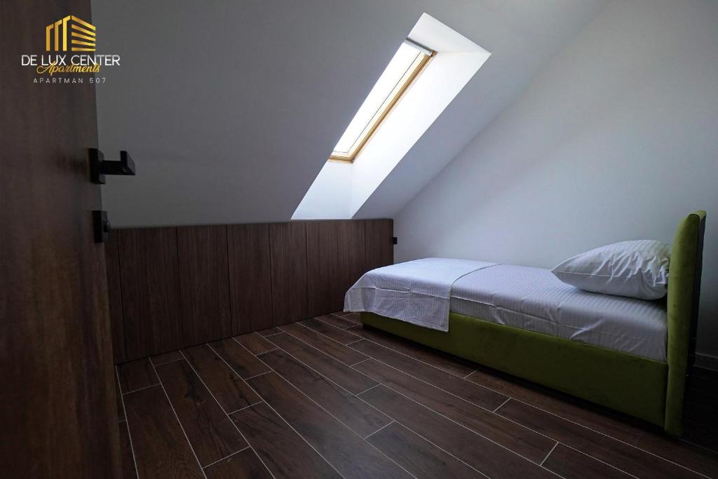 Postel nebo postele na pokoji v ubytování DeLux Center Apartments Inđija