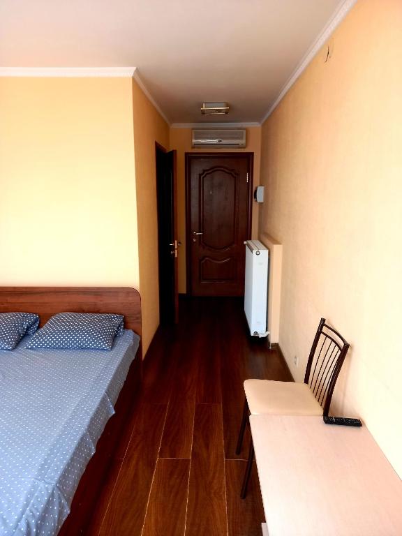 Postel nebo postele na pokoji v ubytování Rodina Hotel