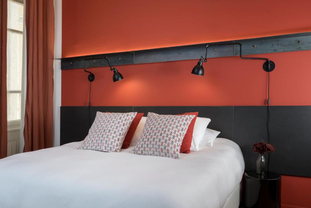 Postel nebo postele na pokoji v ubytování MiHotel Charité
