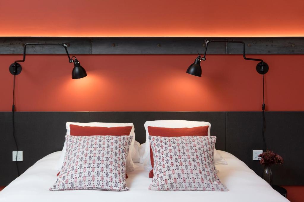 Postel nebo postele na pokoji v ubytování MiHotel Charité