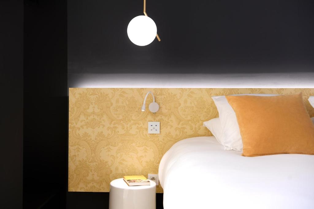 Postel nebo postele na pokoji v ubytování MiHotel Charité