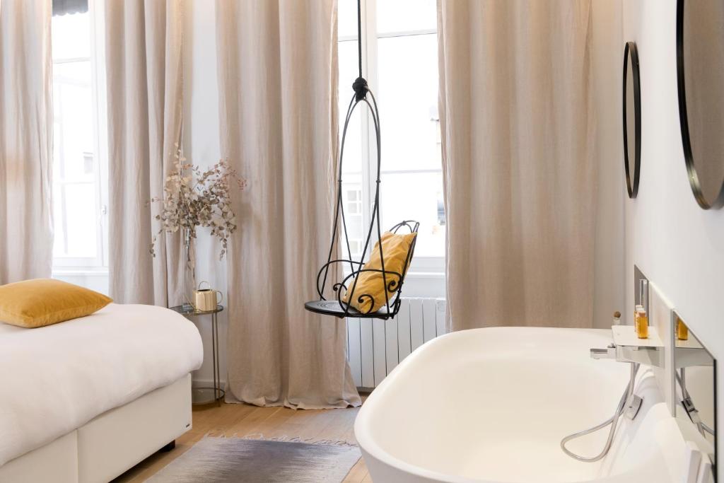Postel nebo postele na pokoji v ubytování MiHotel Charité