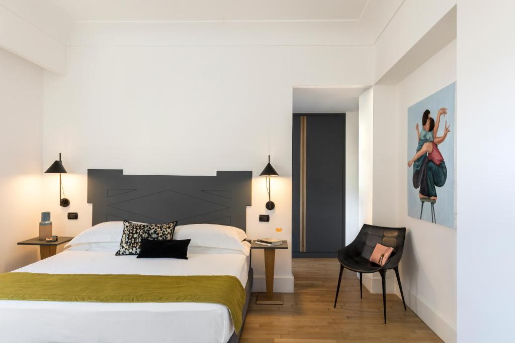 Postel nebo postele na pokoji v ubytování Hotel Plaza Opéra