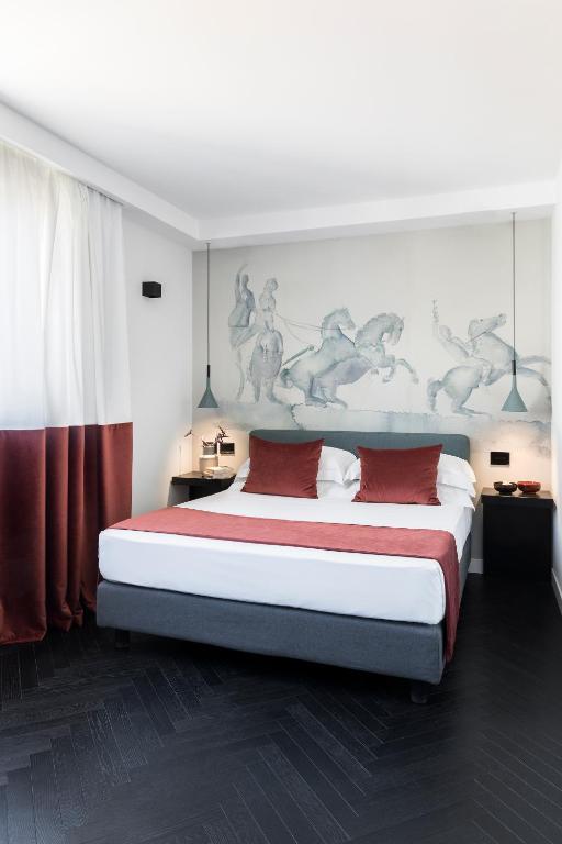 Postel nebo postele na pokoji v ubytování Hotel Plaza Opéra