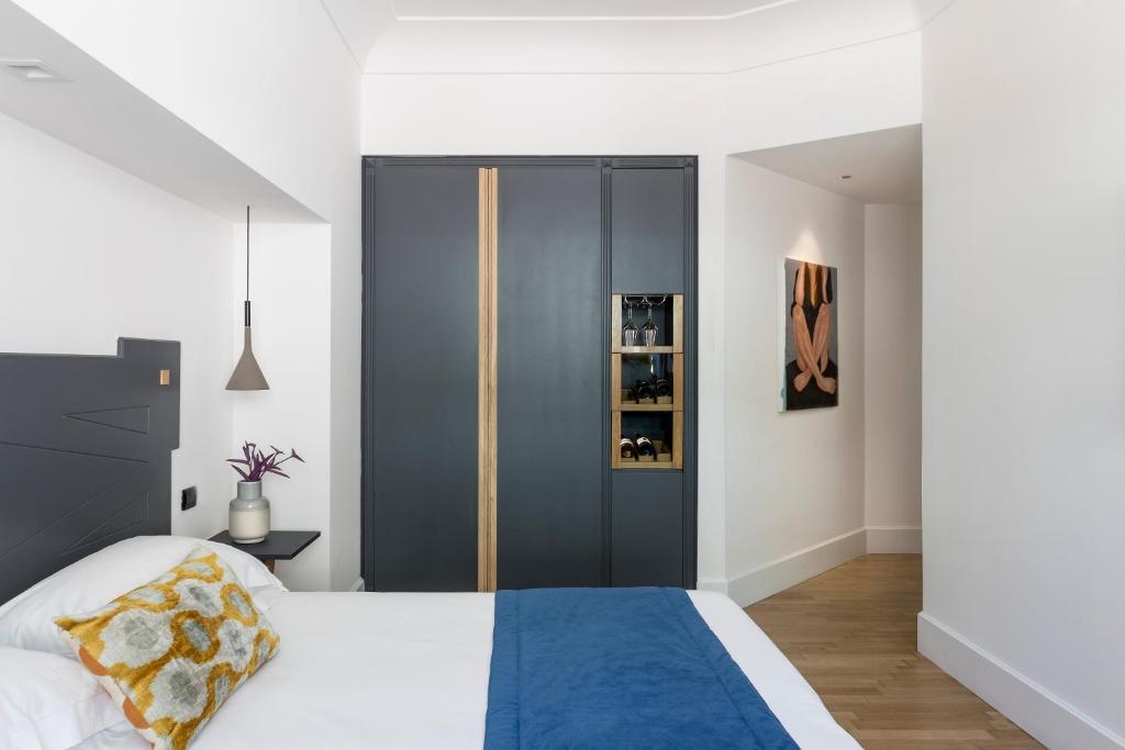 Postel nebo postele na pokoji v ubytování Hotel Plaza Opéra
