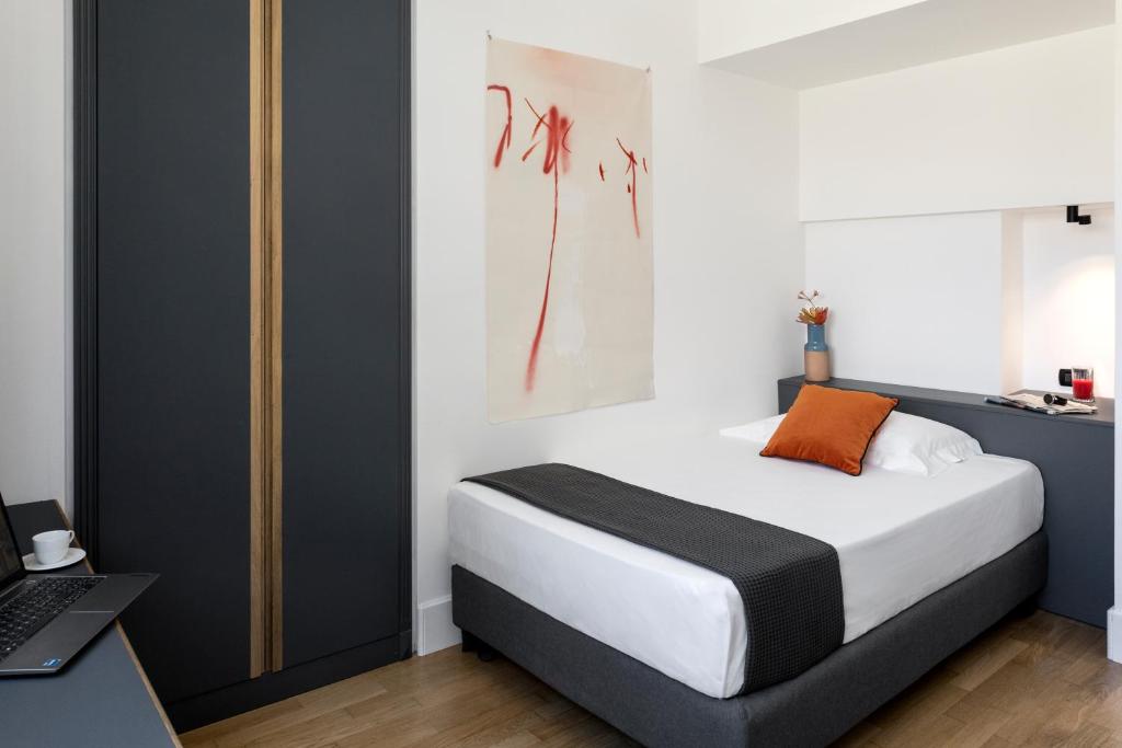 Postel nebo postele na pokoji v ubytování Hotel Plaza Opéra