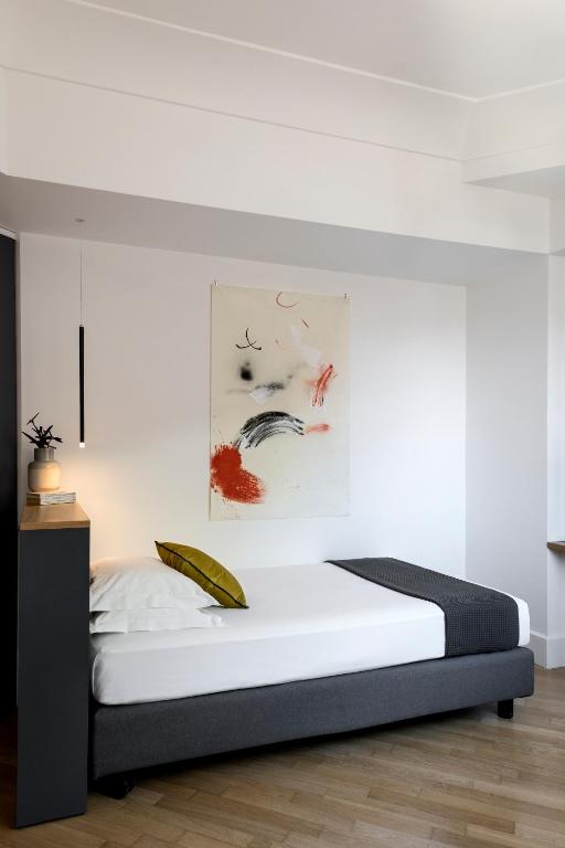 Postel nebo postele na pokoji v ubytování Hotel Plaza Opéra