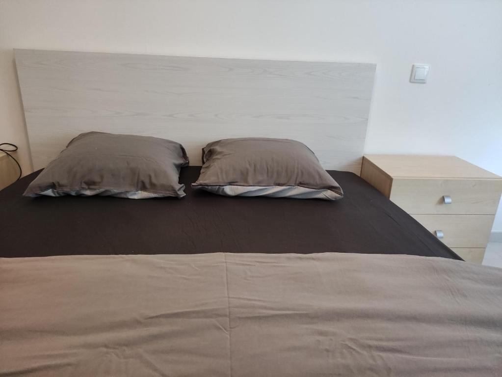 Postel nebo postele na pokoji v ubytování CHEZ WL