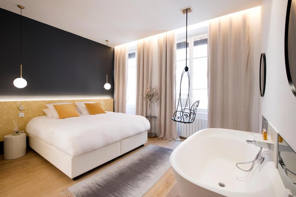 Postel nebo postele na pokoji v ubytování MiHotel Charité